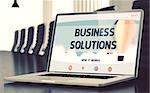 Closeup Business Solutions Concept on Landing Page of Laptop Screen in Modern Meeting Hall. Toned Image. Blurred Background. 3D Render.