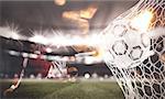 Double exposure image with a ball pierces the soccer goal at the stadium during a night match and a soccer player who is shooting. 3D Rendering
