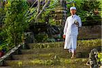 A Balinese priest preparing for the Ngrupuk Parade on the eve of Nyepi Day in Ubud in Gianyar, Bali, Indonesia