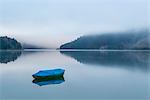 Boat on Sylvenstein Lake in the morning, Bad Tolz-Wolfratshausen district, Bavaria, Germany, Europe
