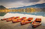 View of rowing boats on Lake Bled and Santa Maria Church (Church of Assumption), Gorenjska, Slovenia, Europe