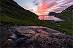 Water of creek flows on rocks, Tjornuvik, Sunda Municipality, Streymoy Island, Faroe Islands, Denmark, Europe