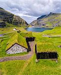 Elevated view of typical grass roof (turf roof) houses, Saksun, Streymoy Island, Faroe Islands, Denmark, Europe (Drone)