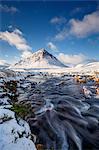 A wintery scene at Buachaille Etive Mor and River Coupall, Glencoe, Highlands, Scotland, United Kingdom, Europe