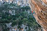 A climber scales cliffs at Kyparissi, southern Greece, Europe