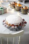 Iced cake on table with decorative lights