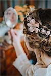 Bride looking at her reflection in mirror