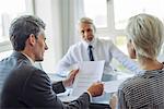 Businessman meeting with couple