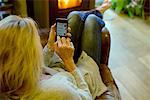 Woman using smartphone at home