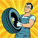 Male car mechanic with wheel. Pop art retro vector illustration comic cartoon kitsch drawing