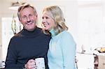 Portrait smiling mature couple drinking tea