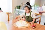 Girl making a cake