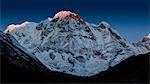 The first rays of light on the summit of Annapurna South, Himalayas, Nepal, Asia