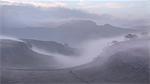 View over mist shrouded Giggleswick Scar towards Langcliffe with Attermire Scar on the horizon, Ribblesdale, Yorkshire Dales, Yorkshire, England, United Kingdom, Europe