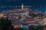 Elevated view over the old town of Korcula Town at dusk, Korcula, Croatia, Europe