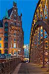 Typical building of the Speicherstadt (Warehouse Complex) and Kornhausbrucke (Kornhaus Bridge) at dusk, Hamburg, Germany, Europe