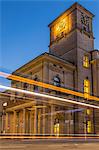 The clock tower of the Hamburg Chamber of Commerce building with traffic light trails during dusk, Hamburg, Germany, Europe