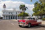 Red Chevrolet Bel Air parked in Cienfuegos town square, UNESCO World Heritage Site, Cuba, West Indies, Caribbean, Central America