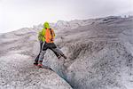 Two people climbing Qualerallit glacier, rear view, Narsaq, Kitaa, Greenland