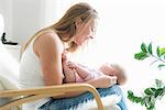 Mother and baby on chair