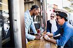 Vendor taking food orders from customer