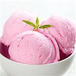 Strawberry ice cream in bowl close up.