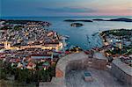 Elevated view over Hvar Town from the Spanish Fortress at dusk, Hvar, Croatia, Europe