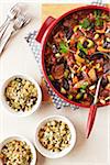 Beef Tagine stew served with bowls of couscous