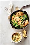 Asparagus, lemon and caper skillet chicken with a side dish of couscous