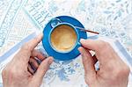 Cropped overhead view of woman with espresso