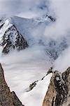 Looking down to the Vallee Blanche and the Cosmiques Hut used by climbers on Mont Blanc, small figures are seen in the valley, Chamonix, Haute Savoie, Rhone Alpes, France, Europe