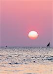 Dhow sailing boat on Indian Ocean at sunset, Stone Town, Zanzibar Island, Tanzania, East Africa, Africa