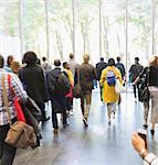 Business people leaving office lobby