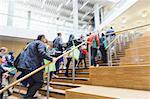 Business people ascending office stairs