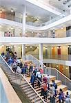 Business people ascending modern office stairs