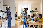 Grandparents and grandchildren baking in kitchen