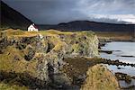 Remote house on craggy, remote cliff, Arnarstapi, Snaefellsnes, Iceland