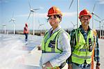 Portrait confident engineers at alternative energy power plant