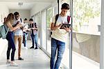 Students hanging out in school corridor