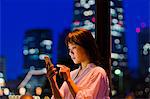 Woman with Mobile in Night City