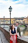 Young couple by Ponte Vecchio, the Old Bridge, Florence, Toscana, Italy