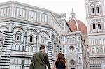Young couple in front of Santa Maria del Fiore, Florence, Toscana, Italy