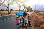 Loaded touring motorcycle parked on roadside, High Sierra National Forest, California, USA