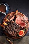 Citrus and rib roast on a wooden cutting board