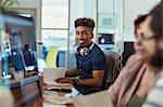 Portrait smiling, confident creative businessman working in office