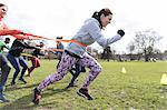 Team building strap exercise in park