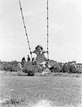 1930s 1940s GIRL OUTDOOR ON PLAYGROUND SWING