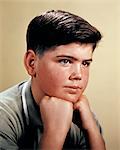 1960s TEEN BOY PORTRAIT RESTING HIS HEAD IN HIS HANDS THOUGHTFUL POSE THINKING