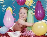 1960s BABY GIRL HUGGING BALLOON CONFETTI STREAMERS SMILING HAPPY