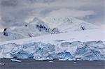 Low lying clouds over the mountains and blue glaciers of Paradise Bay, Antarctic Peninsula, Antarctica, Polar Regions